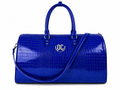 Royal duffel bag made from dyed royal blue crocodile leather for durable and stylish travel